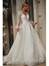 Šaty s transparentním, balónovým rukávem, šaty jsou pošity drobnými lístky, bohatá sukně, vzadu hluboký výstřih do V. 