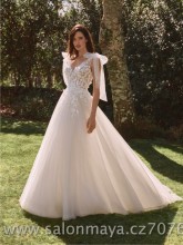 Svatební šaty v barvě ivory s bohatou tylovou sukní, šaty jsou na ramínka, která se dají zavázat v mašle, top je zdoben krajkou. 