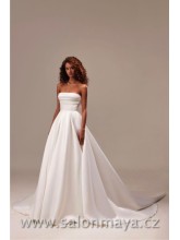 Korzetové svatební šaty s řasením na prsou, bohatá sukně, výkroj a velká zdobná mašle na zádech. 